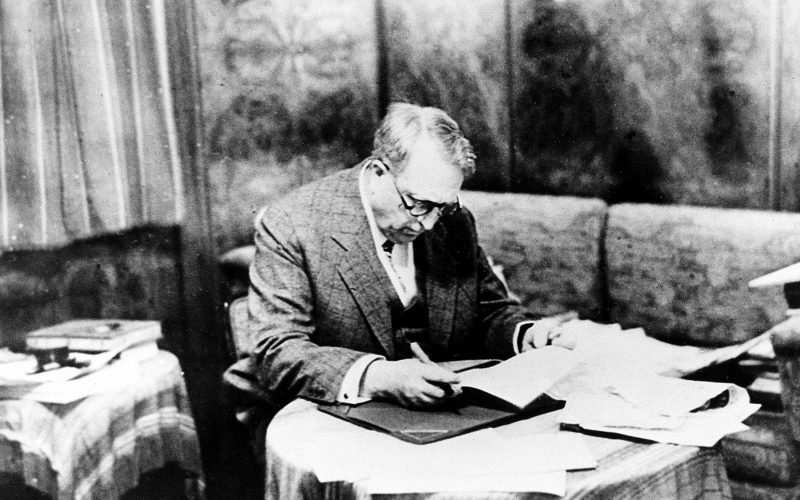 William Randolph Hearst is seen working in his suite aboard the S.S. Europa during a transatlantic crossing in 1931.