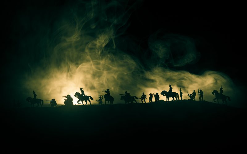 The outline of soldiers on horseback