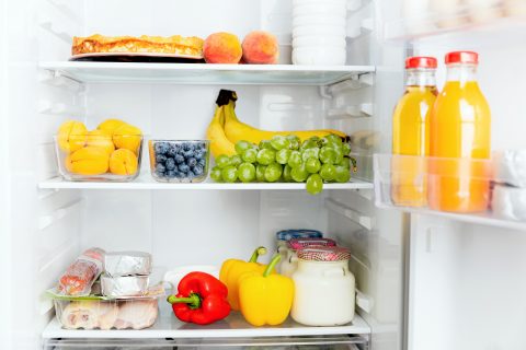 A refrigerator filled with fruits, vegetables and other food