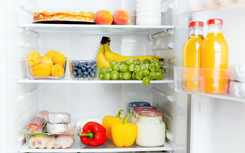 A refrigerator filled with fruits, vegetables and other food