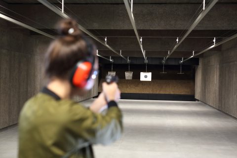 A woman at a gun range