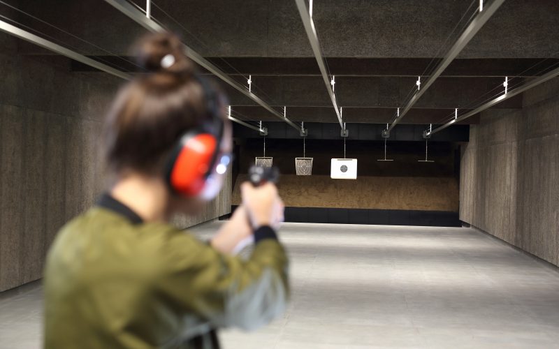 A woman at a gun range